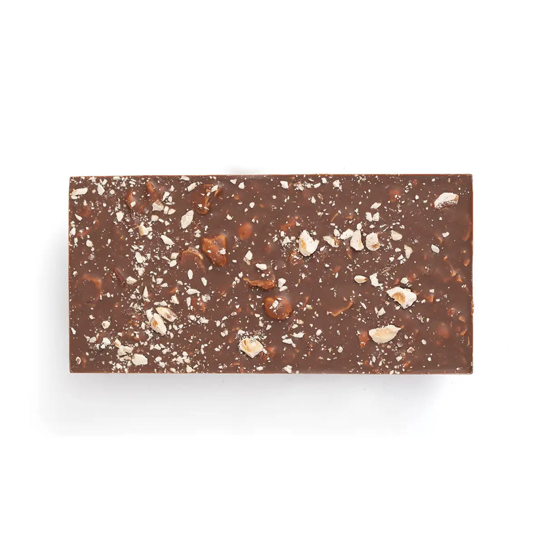 Chocolate bar with visible nuts on a white background
