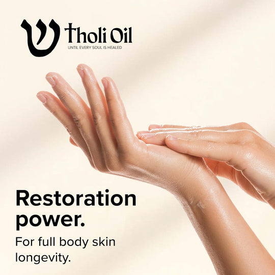 Advertisement for Tholi Oil with hands applying oil, featuring the brand logo and text about skin care.