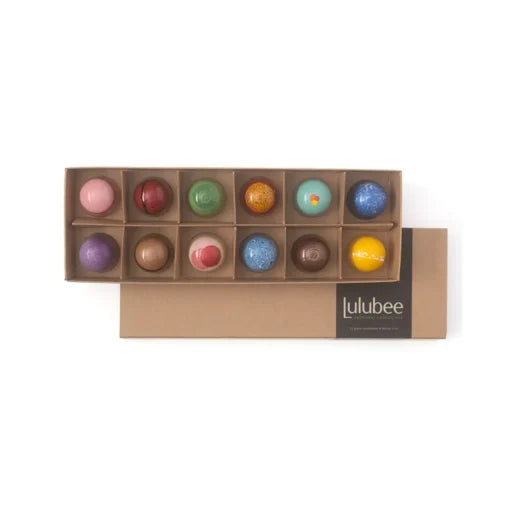 Box of colorful truffles with Lulubee branding on a white background