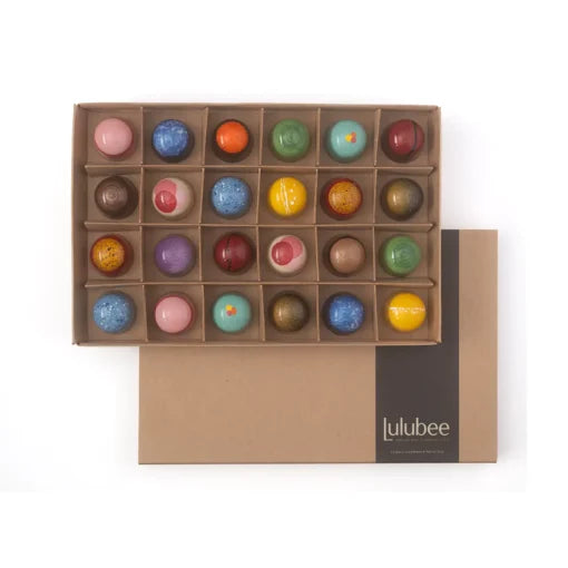 Box of colorful truffles with Lulubee branding on a white background