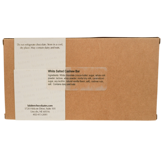 Cardboard box with white label displaying text and product details on a white background