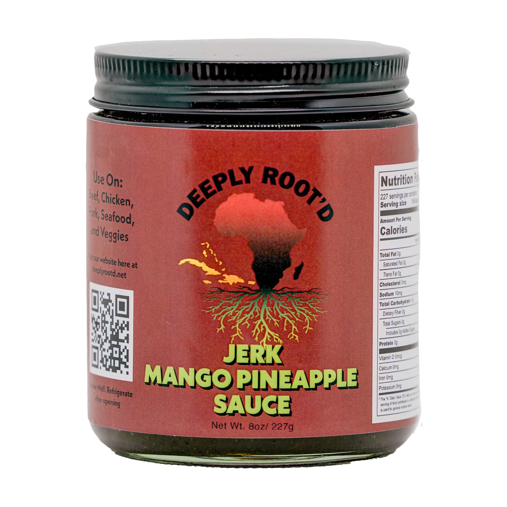 A jar of Deeply Root'd Jerk Mango Pineapple Sauce with a label showing the product name and a graphic of a sun and roots.