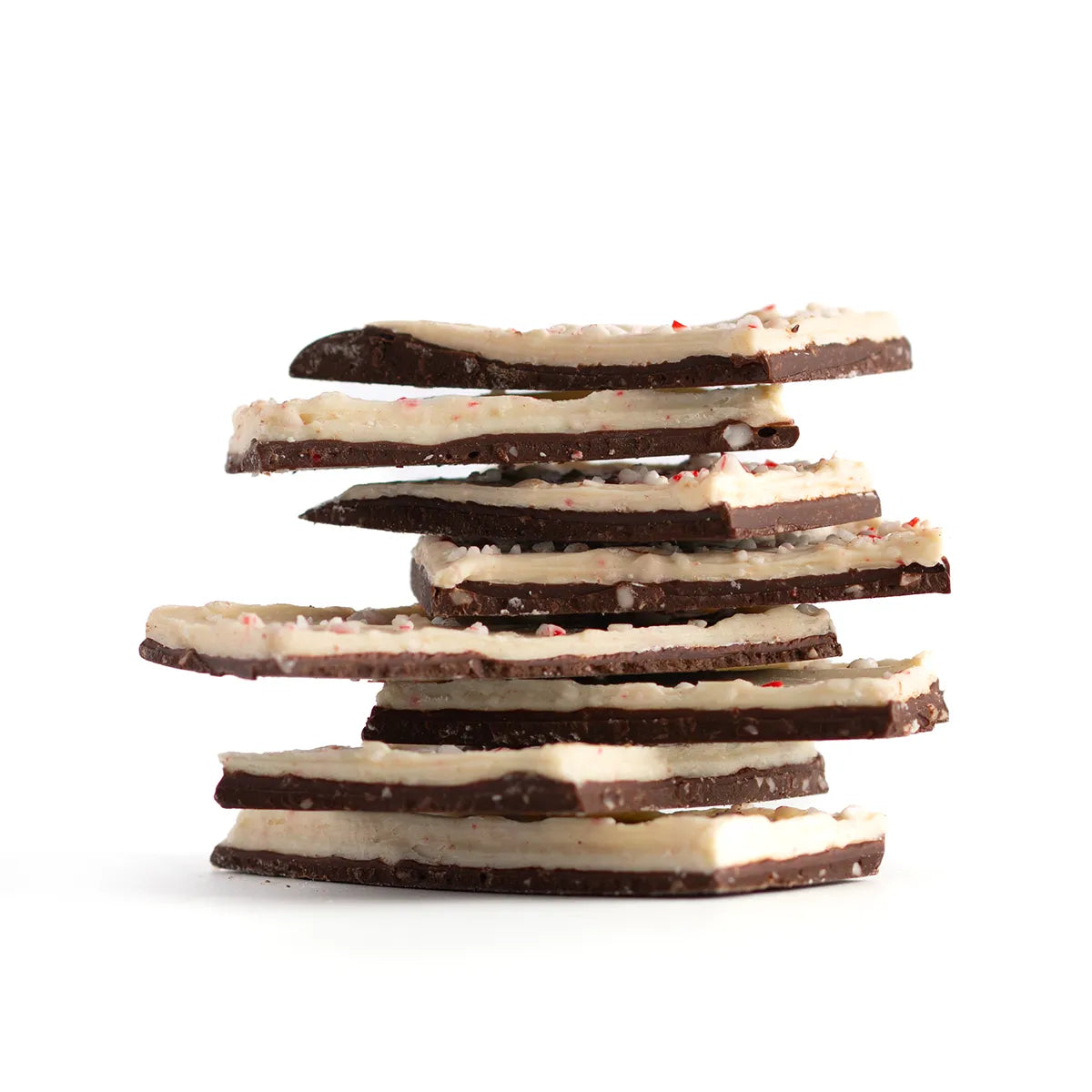 Stack of chocolate bark pieces on a white background