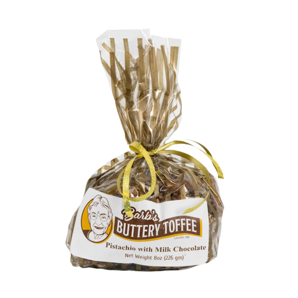 A packaged product labeled 'Barb's Buttery Toffee' with pistachios with milk chocolate, net weight 8 oz (226g). 