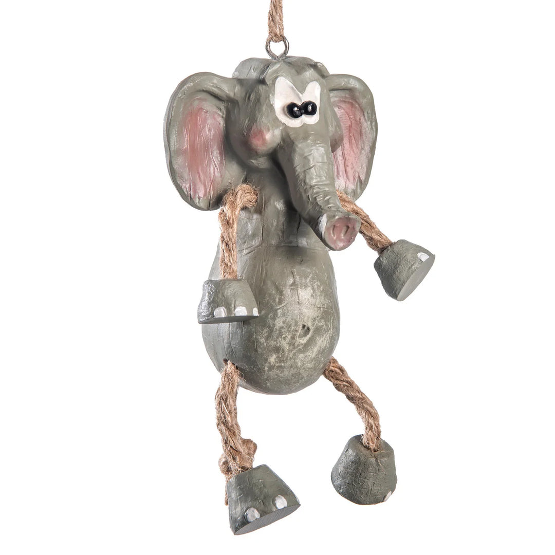 Decorative elephant ornament with bell on a white background