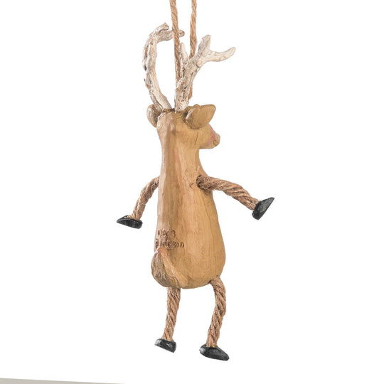 Wooden reindeer ornament with rope legs and antlers on a white background