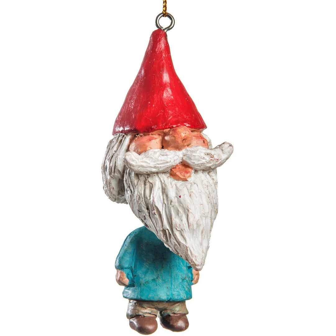 Gnome figurine with a red hat and blue clothing on a white background
