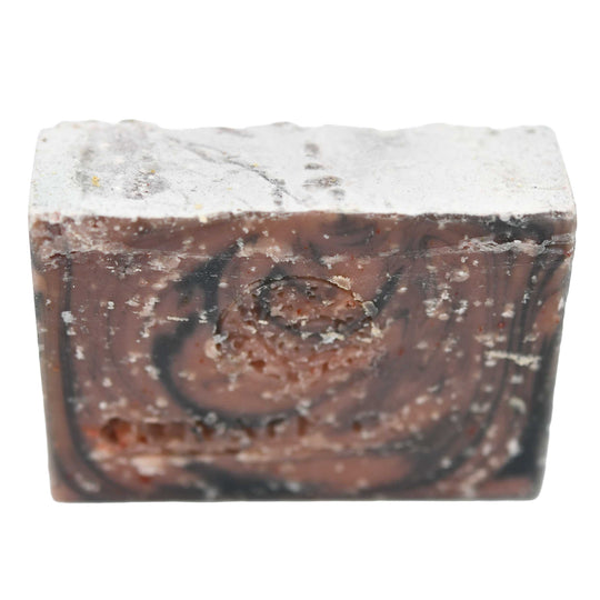Marbled brown and white soap bar on a white background