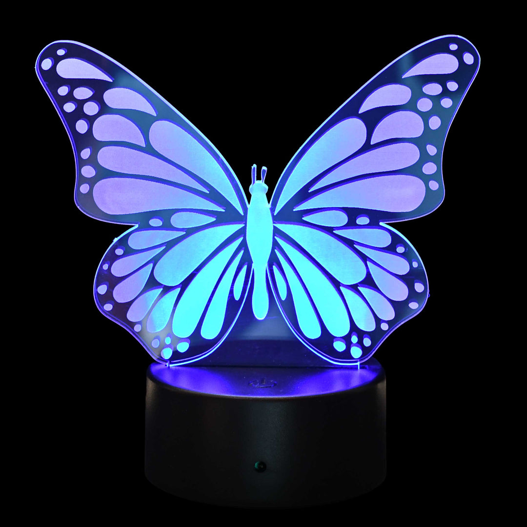 A 3D optical illusion LED night light shaped like a butterfly, glowing with blue and purple light on a black base against a black background.