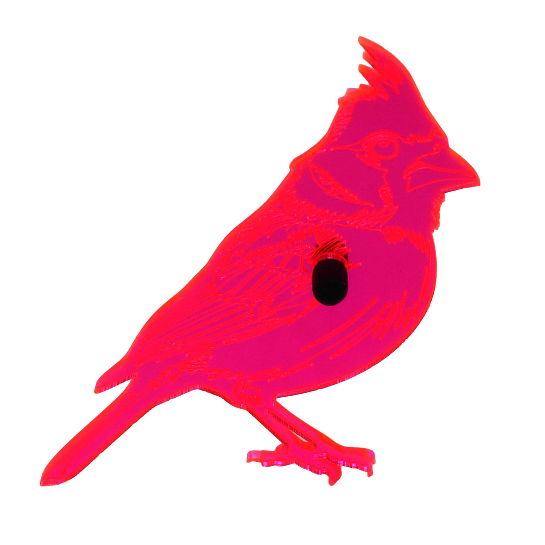 A bright neon pink cardinal bird silhouette decal or sticker with a black oval eye detail, shown on a plain white background.