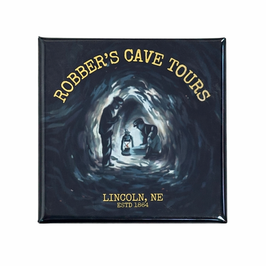 Fridge magnet with 'Robber's Cave Tours' text and cave scene on a dark background
