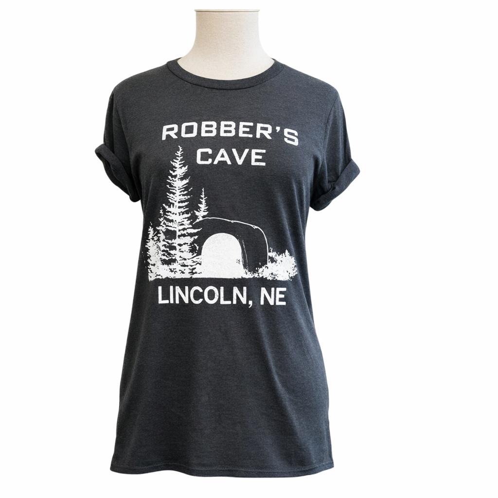 Black t-shirt with 'Robber's Cave Lincoln, NE' print on a mannequin against a white background