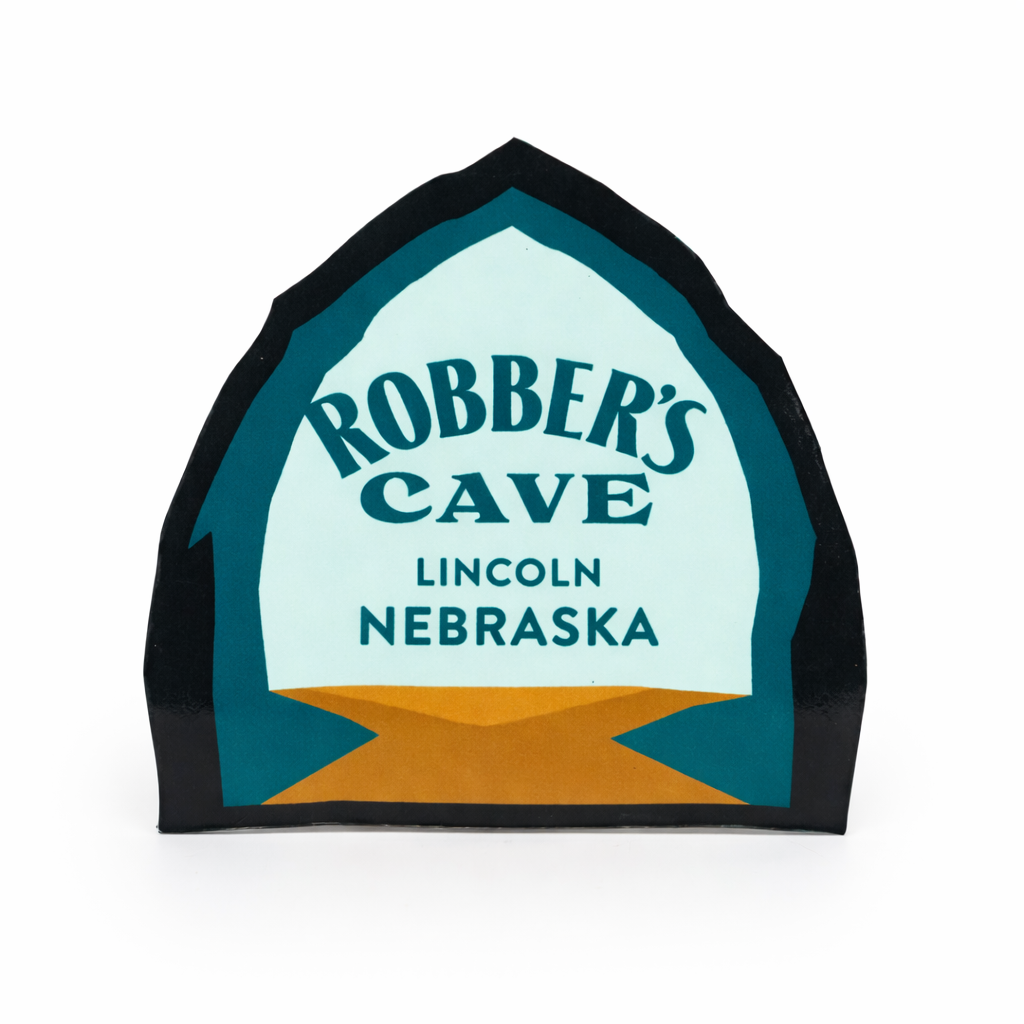 Decorative magnet for 'Robber's Cave' in Lincoln, Nebraska with a black border.