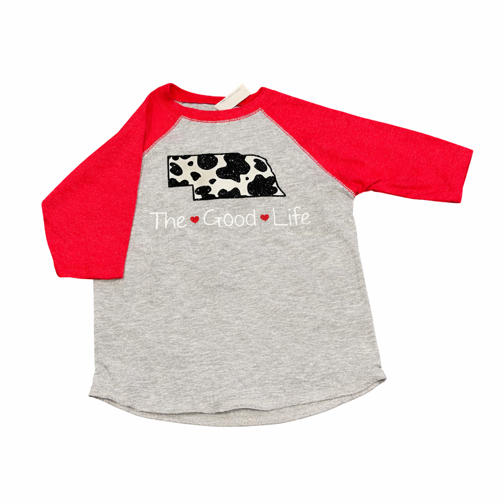 Gray and red baseball shirt with cow print and 'The Good Life' text on a white background