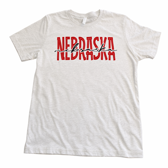 Heather gray  t-shirt with 'NEBRASKA' printed in red and black on a white background