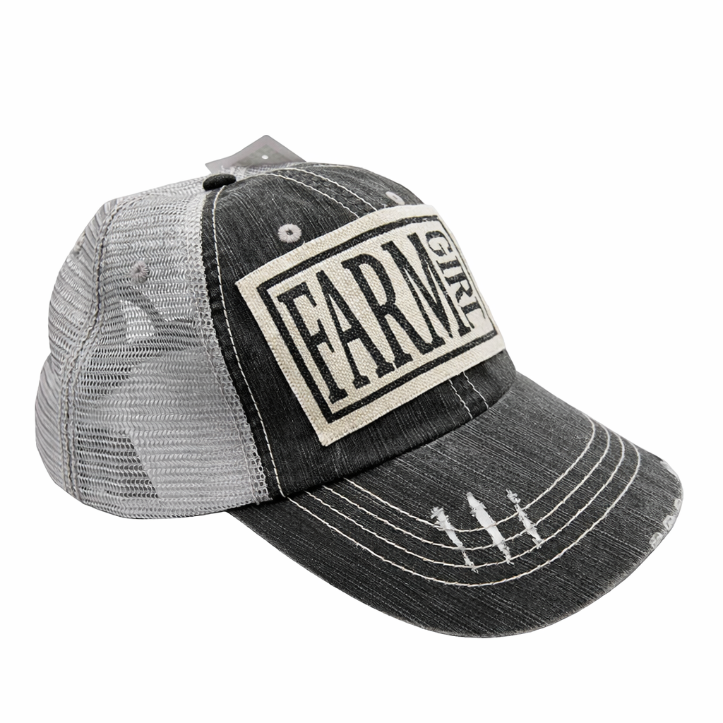 Black and gray cap with 'Farm Girl' logo on a white background