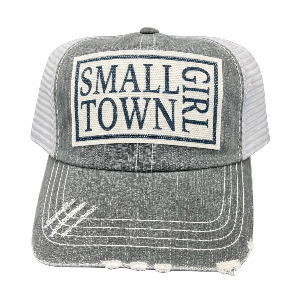 Gray trucker hat with 'Small Town Girl' patch on a white background