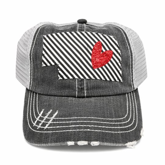 Black and white striped cap with a red heart on a white background
