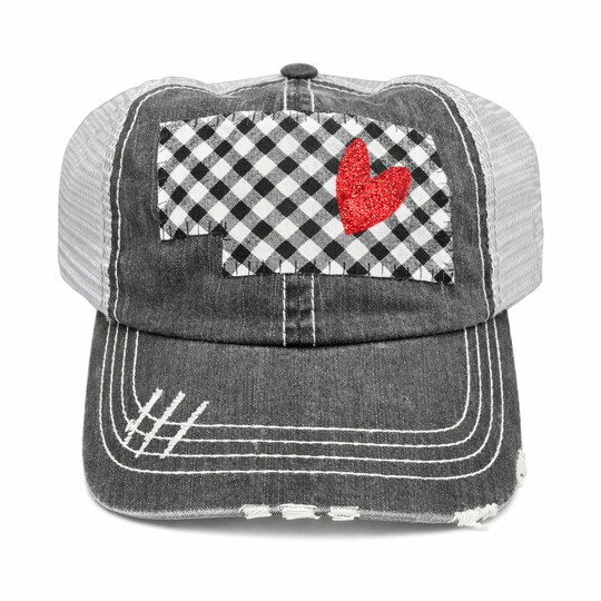 Black and white checkered patch with red heart on a distressed cap