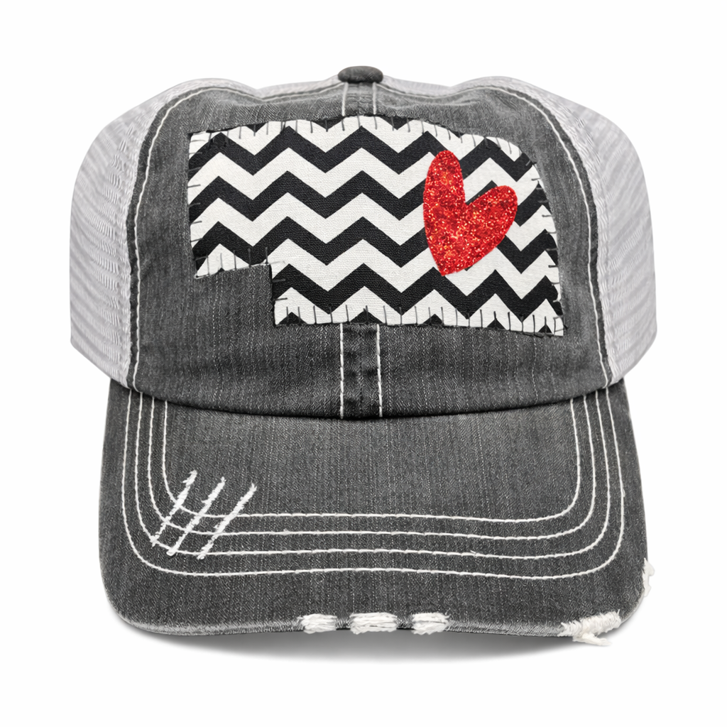 Gray cap with black and white chevron pattern and red heart on a white background