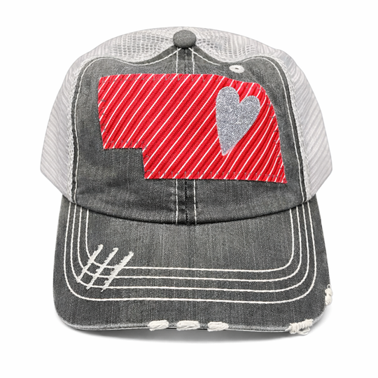 Gray cap with red and gray heart design on a white background