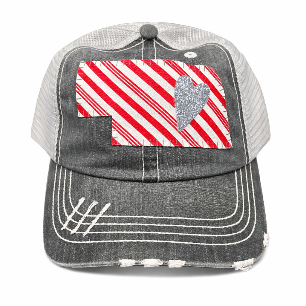 Gray cap with red and white striped patch and heart design on a white background