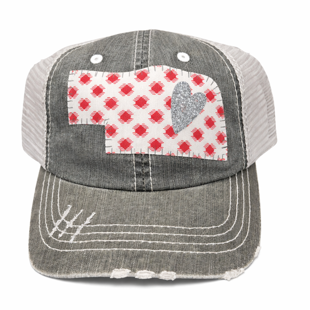 Gray cap with a red and white checkered patch featuring a heart on a white background