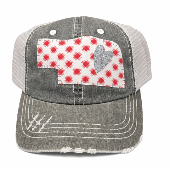 Gray cap with a red and white checkered patch featuring a heart on a white background