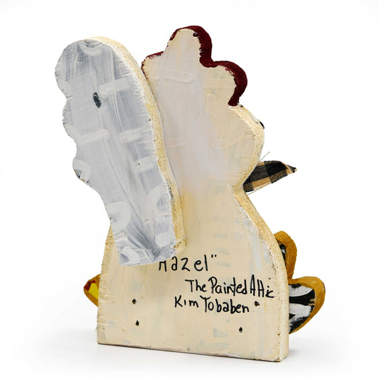 Decorative item shaped like a chicken with 'Hazel' and 'The Painted Attic Kim Tobaben' written on it, on a white background.