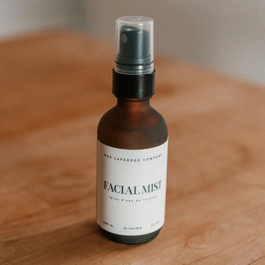 Facial mist bottle labeled 'Facial Mist' on a wooden surface