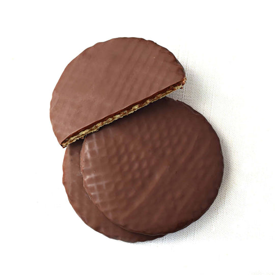 Two chocolate-covered wafers on a white background