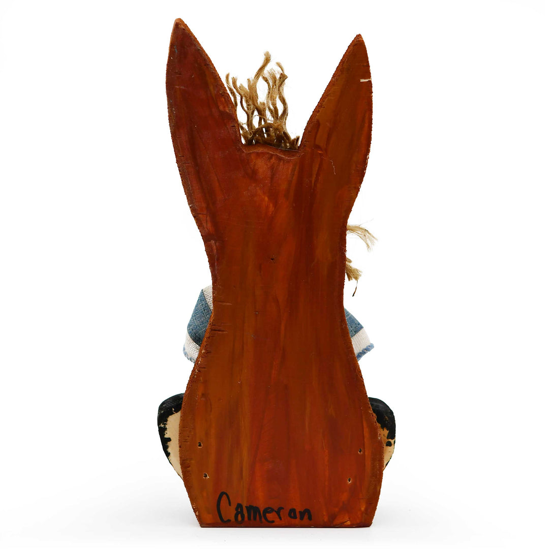 Wooden rabbit sculpture with 'Cameron' engraved on a white background