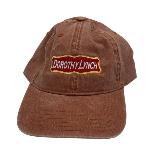 The orange Dorothy Lynch hat on a white background