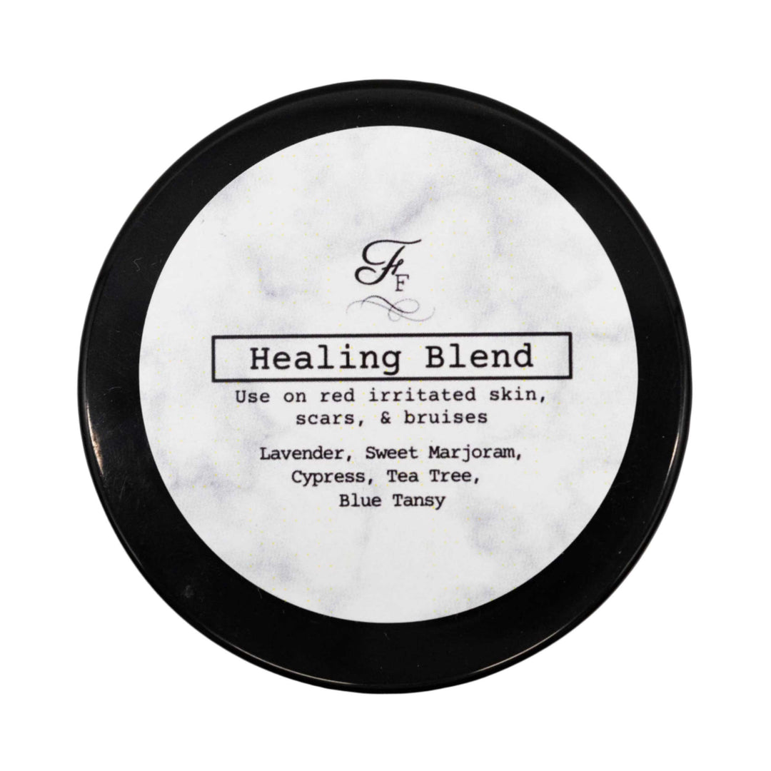 Round container labeled 'Healing Blend' with black lid on a white background
