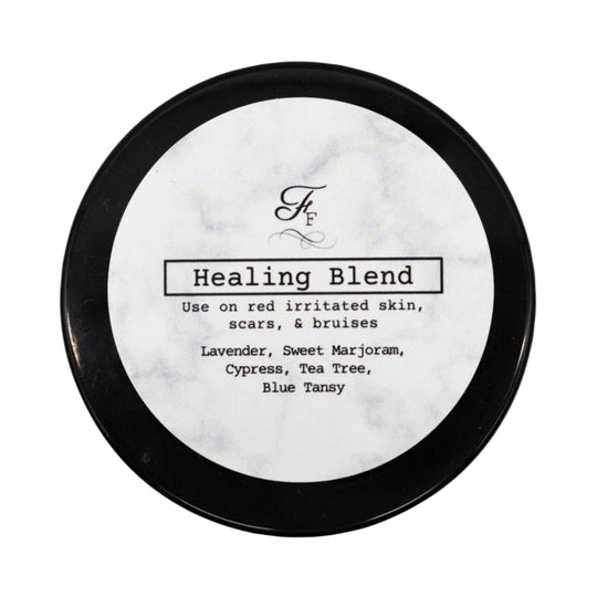 Round container labeled 'Healing Blend' with black lid on a white background