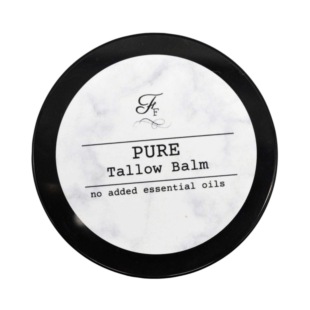 Pure tallow balm container with black lid on a white background