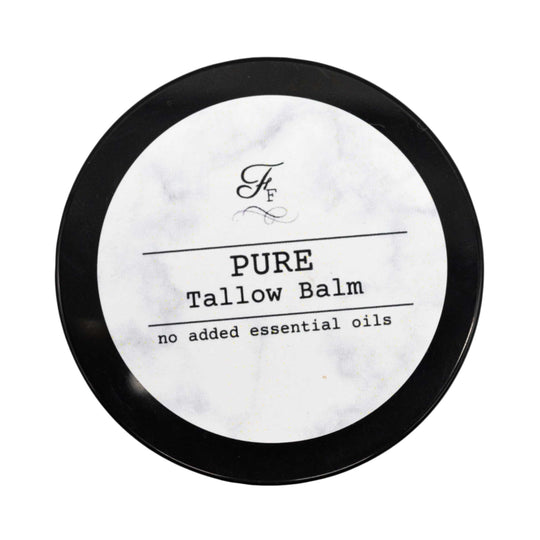 Pure tallow balm container with black lid on a white background