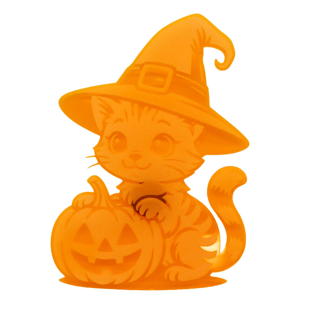 An orange cartoon cat wearing a witch hat and sitting next to a carved pumpkin, isolated on a white background.