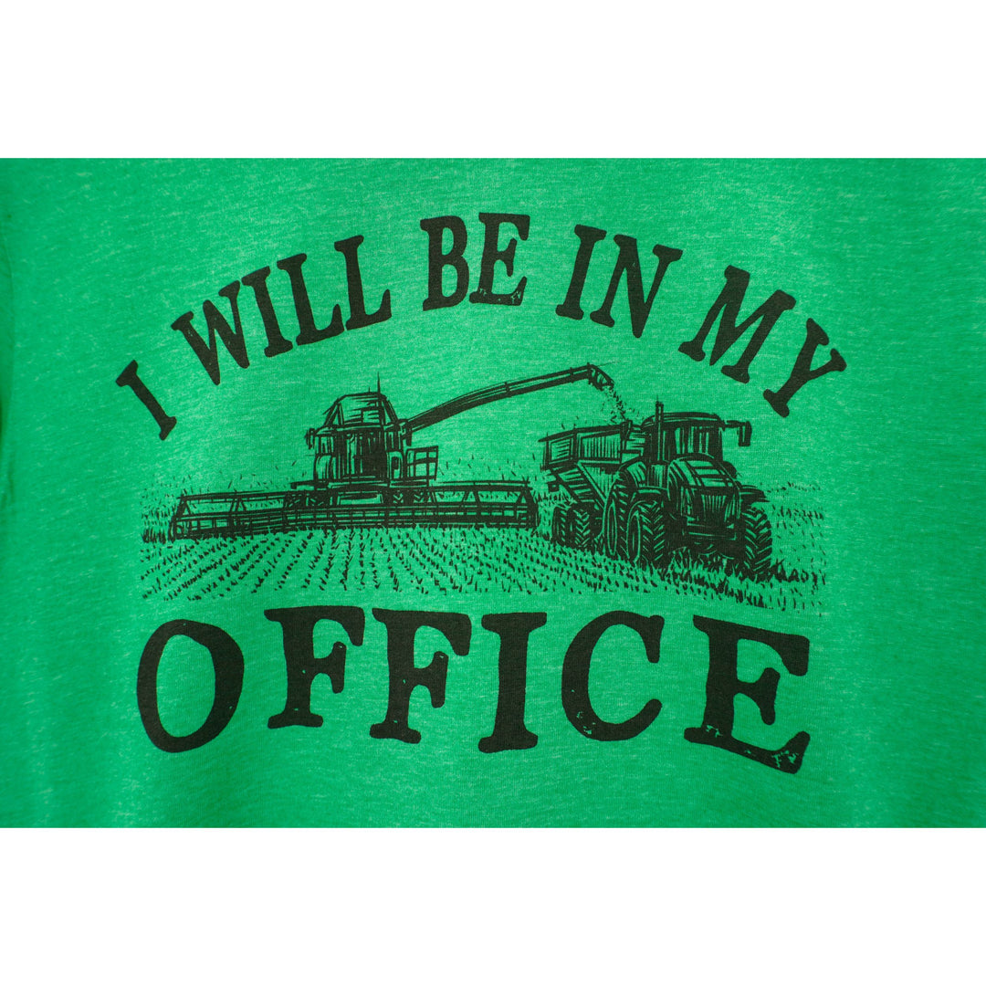 Green t-shirt with a tractor graphic and text 'I WILL BE IN MY OFFICE' on a white background