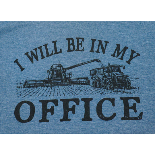 Blue t-shirt with a tractor graphic and text 'I WILL BE IN MY OFFICE' on a white background