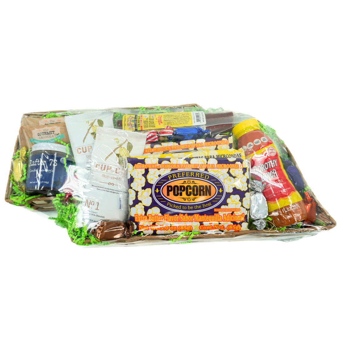 Assorted popcorn kernels and related products in a clear plastic tray on a white background