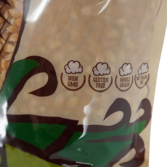 Bag of popcorn kernels with certification labels for non-GMO, gluten-free, whole grain, and no trans fat.