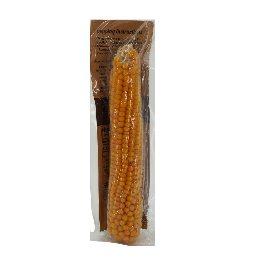 Packaged corn on the cob with a label on a white background