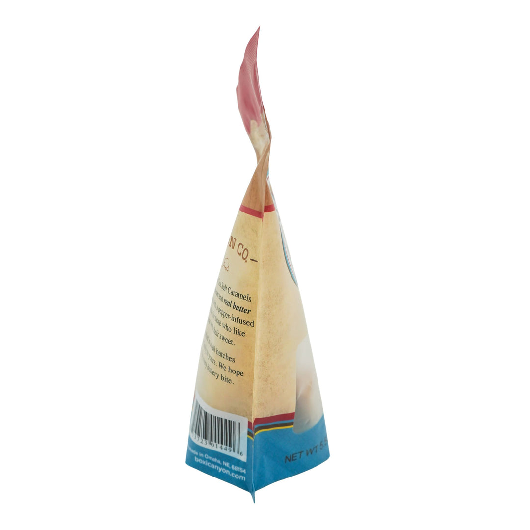 Back view of a triangular snack package with visible branding and text on a white background