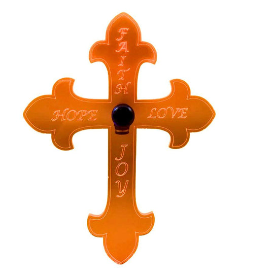 An orange glowing "Faith, Hope, Love, Joy" cross on a white background