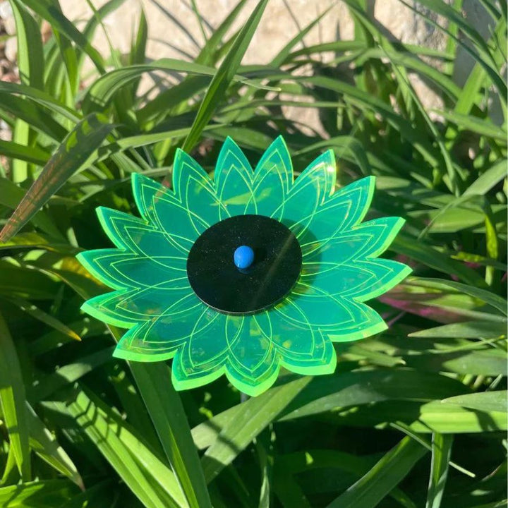 A green glowing sunflower in grass