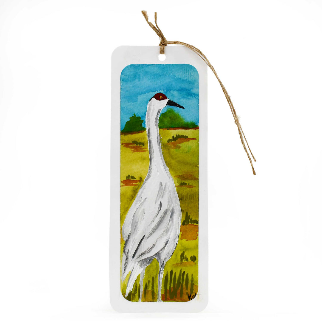 Bookmark with a crane illustration on a scenic background