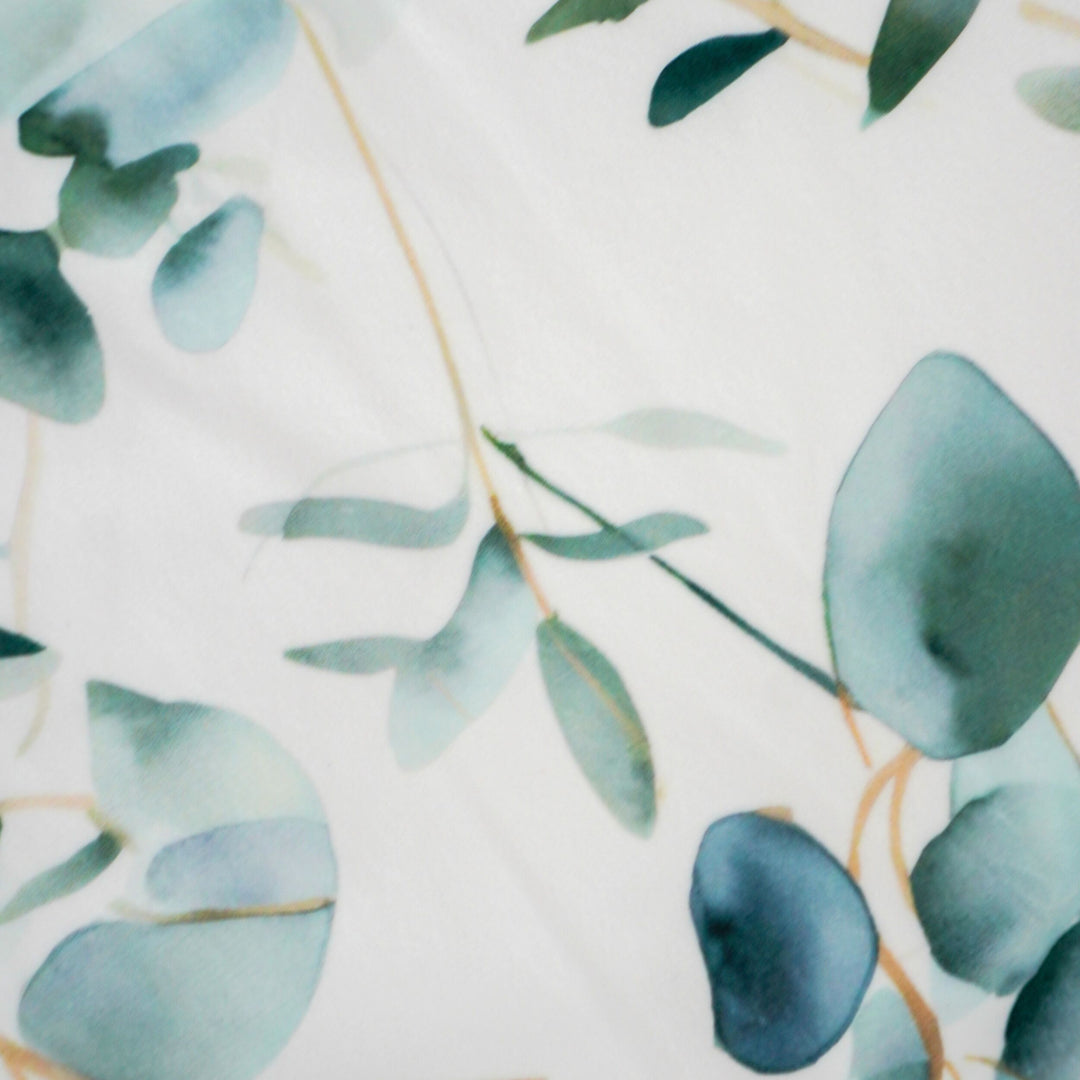 Close-up of green leaves on a light background