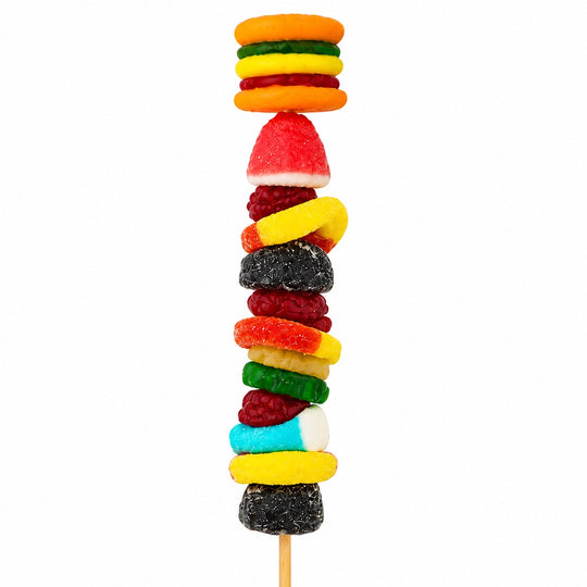 Hamburger candy kabob featuring a gummy hamburger topper and colorful gummy candies arranged on a wooden skewer, isolated on a white background.