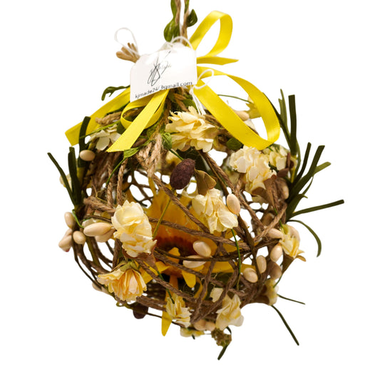 Decorative wreath with yellow flowers and a yellow ribbon on a white background